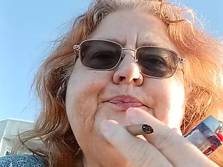 Bearded Lady try's to  lights  on windy beach!