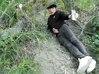 Cute Jon Arteen Gay twink jerks off outdoors, dry-humps the air, and shoots cum through a hole in his pants