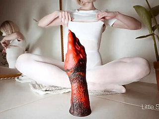 Red Hero Teases Her Tight Ass with a Huge Dildo
