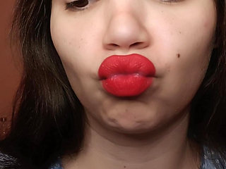 Big red lips smoking close up