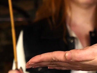 Slave Mila Endures 24 Cold-hearted Hand Caning Strokes From Mistress Roxy