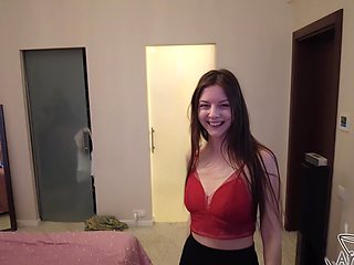 A long-haired brunette has sex with her boyfriend in the shower