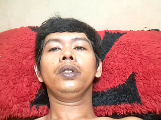 Exotic skinned Asian adult man lying down naked