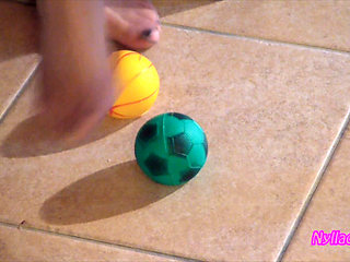 Nyllady Squeezes Rubber Balls Massaging Her Hosed Feet