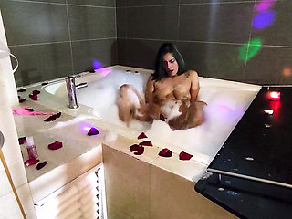 Romantic and wet masturbation in the bathtub for you, with foam and rose petals.