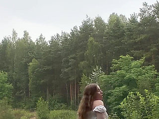 Teen Shows Tits and Asshole During a Storm in the Forest
