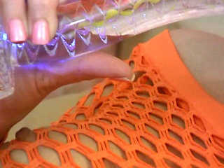 Hot teen in fishnet plays with her vibrator