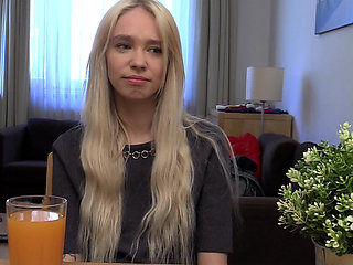 Blonde Babe Grips Purple Vibrator with Naughty Smile