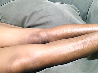 A Woman with Lots of Beautiful Pubic Hair Between Her Legs Lies on Her Sofa Waiting to Be Made Love to Her