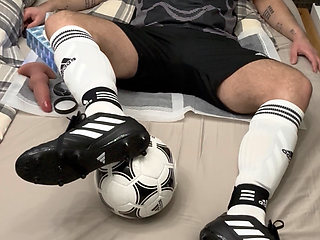 Masked soccer player jerks off in football gear sportswear socks and fucks himself with vibrating butt plug