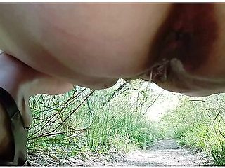 German Milf Walking In The Park Showing Off Her Charms Under Her Skirt Wanted To Pee