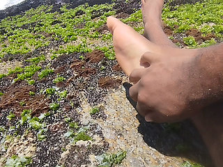 massaging my feet on the beach