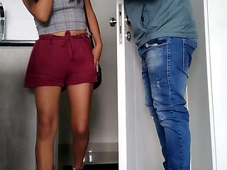 Latina girl couldn't even undress properly as he fucks her in the hallway