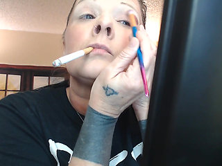 Doing make up dangling smoke