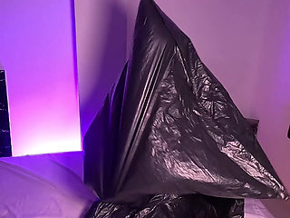 Girl in Garbage Bag Plays with Her Breath