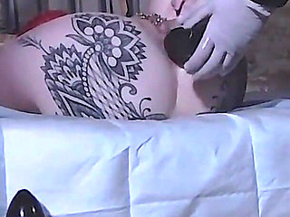 Restrained Girl Has Anal Speculum Insert & Pissed in