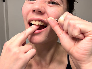 Flossing Teeth with Oral B Glide Dental Floss