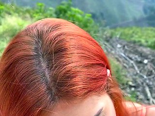 Redhead chained babe gives blowjob