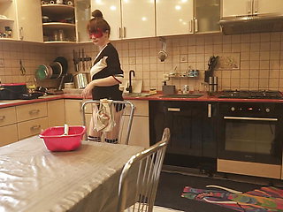 Sexy Dressed Wife Preparing Food in the Kitchen