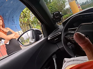 Risky handjob in the car for hottie at the bus stop in public!