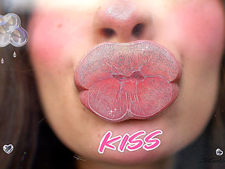 Pillow-soft Glossed Lips in a Melting Sensual Kiss