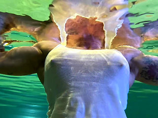 Amazon Kandy Flexes Her Massive Biceps in Her Hotel Pool