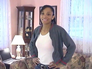 Cute little black chick shows off her skinny beautiful bod on a couch
