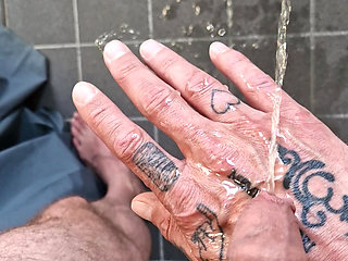 In the bathroom I give myself a golden shower on my hand, then and cum nicely