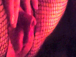 Muscle woman does it herself in fishnet stockings and wets herself