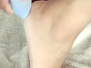 Barefoot Woman Getting a Pedicure