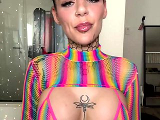 Inked Hottie with Buns Teases in Shiny Rainbow Mesh Top
