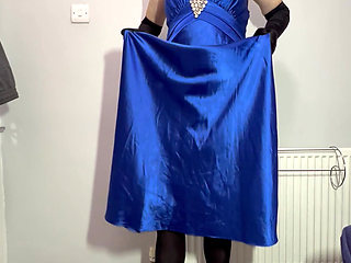 Sissy crossdresser playing in a satin ball gown