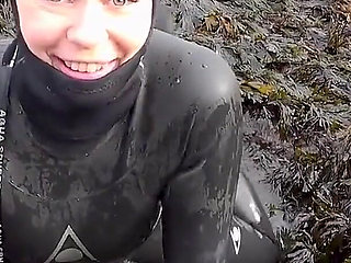 Rubbery Beach Encounter: Lucy's Neoprene Pussy Play with Stranger