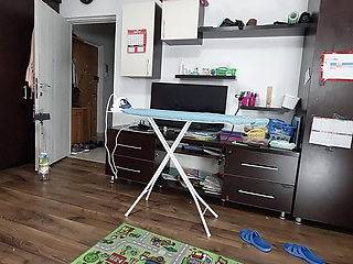 Sexy brunette doing naked chores around the house.