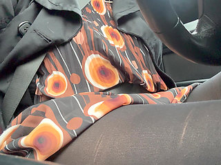 Elegant stepmom drives to the office wearing tights and a beautiful dress