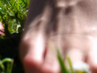 Nyllady Walking Barefoot on Th Grass in a Park