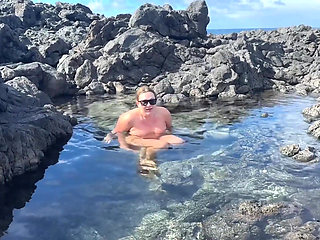 Nudist Girl Swimming Naked in the Natural Pool Outdoor