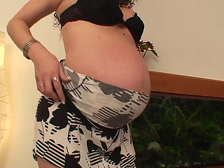 Brunette is pregnant with hairy pussy