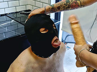 Mistress Nika fucks a slave in the mouth, humiliates, spits, slaps and orders him to suck deeper