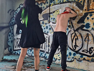 Back Flogging. Dominatrix Nika Punishes Her Slave With Whipping. Punishment In An Abandoned Building