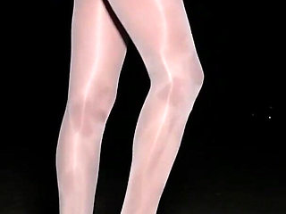 Anna in white shiny pantyhose on the night beach