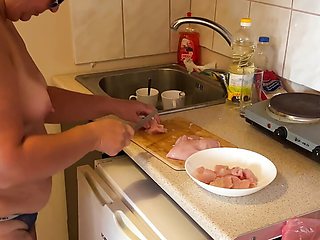 Zara is cooking topless in the kitchen