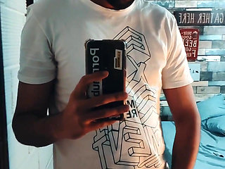 Jerking off my big uncut cock in front of the mirror and eating my cum