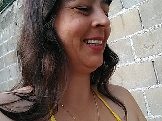 Amateur wife teasing you outside wearing a micro bikini