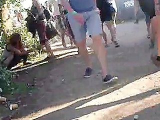 Dude with a camera filming sexy girls in a park