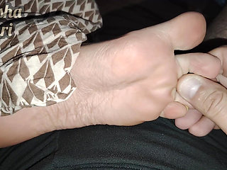 Stepsister's feet get a light massage while watching a movie