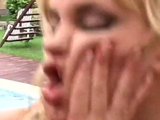 At the poolside the blondes touch and slap each other and then get fucked