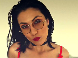 Latina with a Sensual Body Posing in Her Latex Skirt