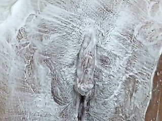 Close-up of Shaving the Vagina with a Trimmer and a Razor