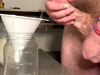Hung Cum God Pumps a Jar Full of His Sperm